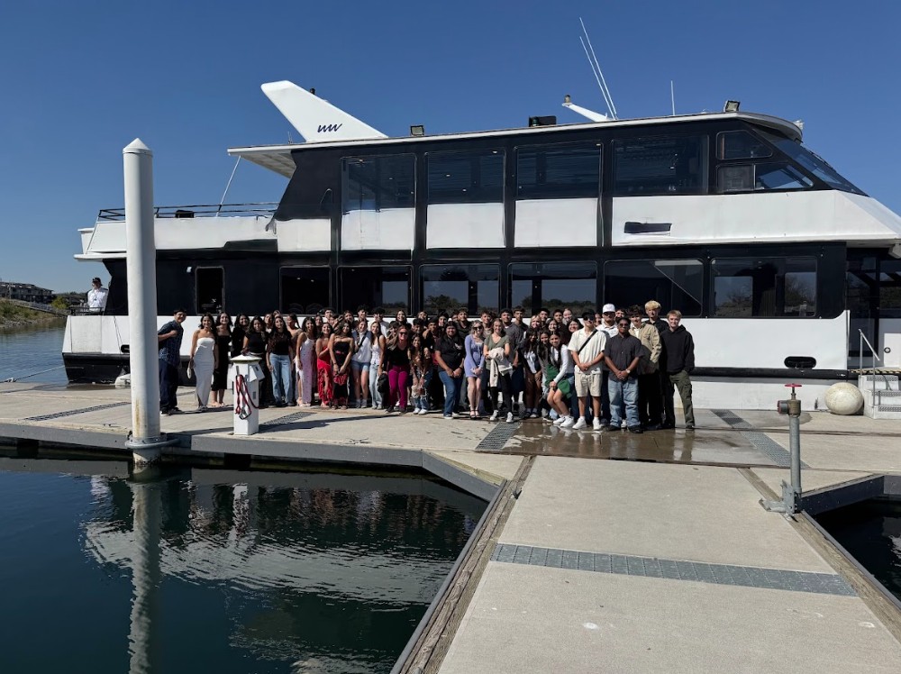 AVID students and teachers prepare to go on a river cruise during their field trip.